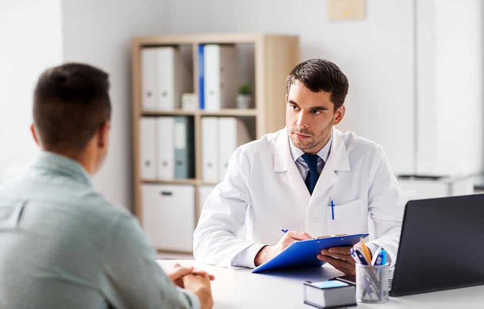 A doctor explaining gynecomastia revision surgery.